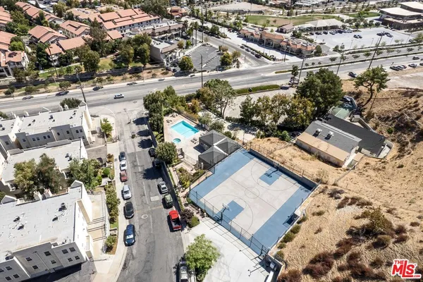 an aerial view of residential houses with outdoor space