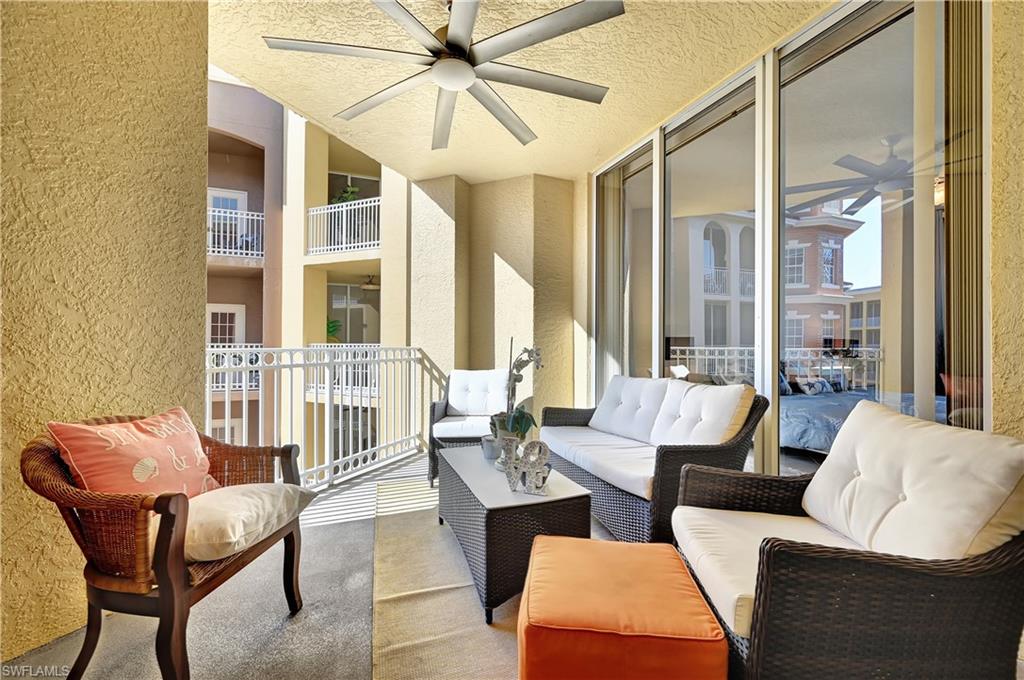 410 Bayfront Place, Unit 2409 Naples, FL 34102 - Photo 13 of 23 a living room with furniture and a large window