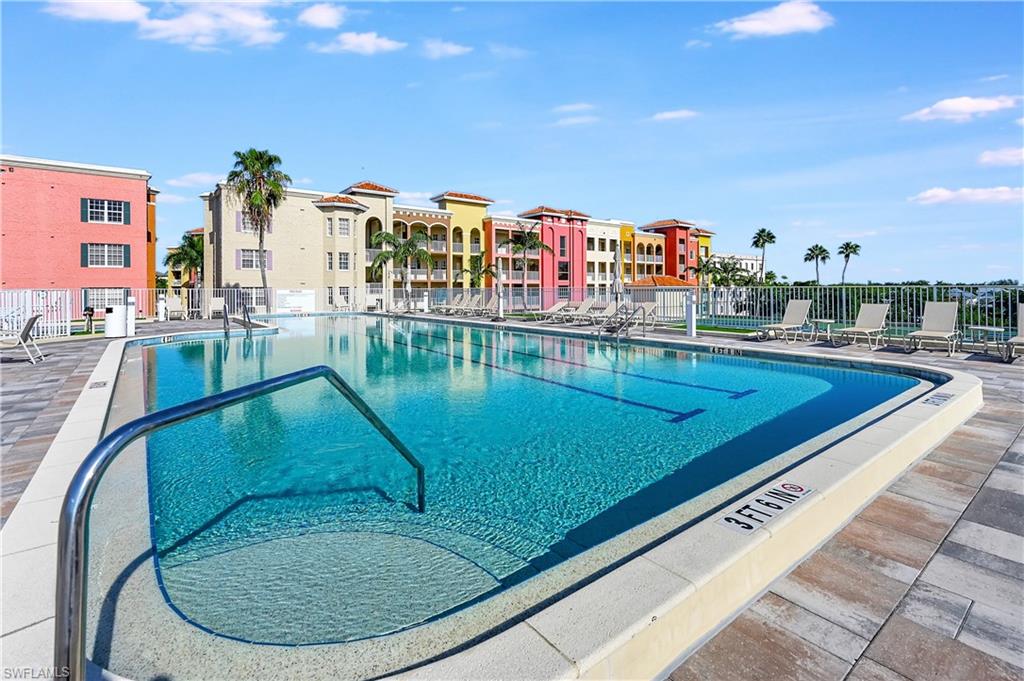 410 Bayfront Place, Unit 2409 Naples, FL 34102 - Photo 14 of 23 a view of a swimming pool with outdoor seating