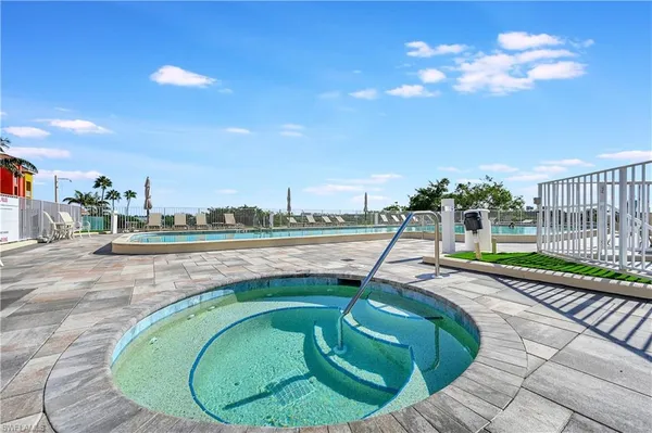 a view of swimming pool having outdoor seating