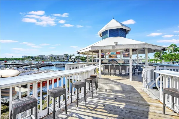 a roof deck with a table and chairs