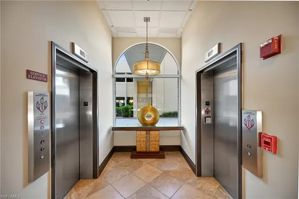 a view of a hallway with elevator