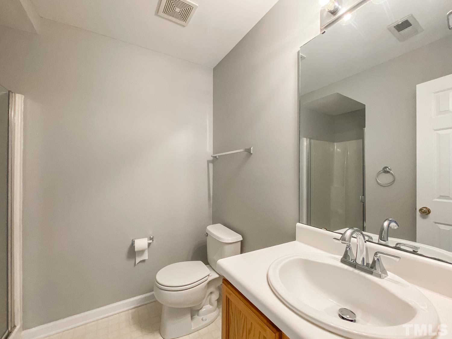 5242 Eagle Trace Drive Raleigh, NC 27604 - Photo 13 of 24 a bathroom with a sink and a toilet