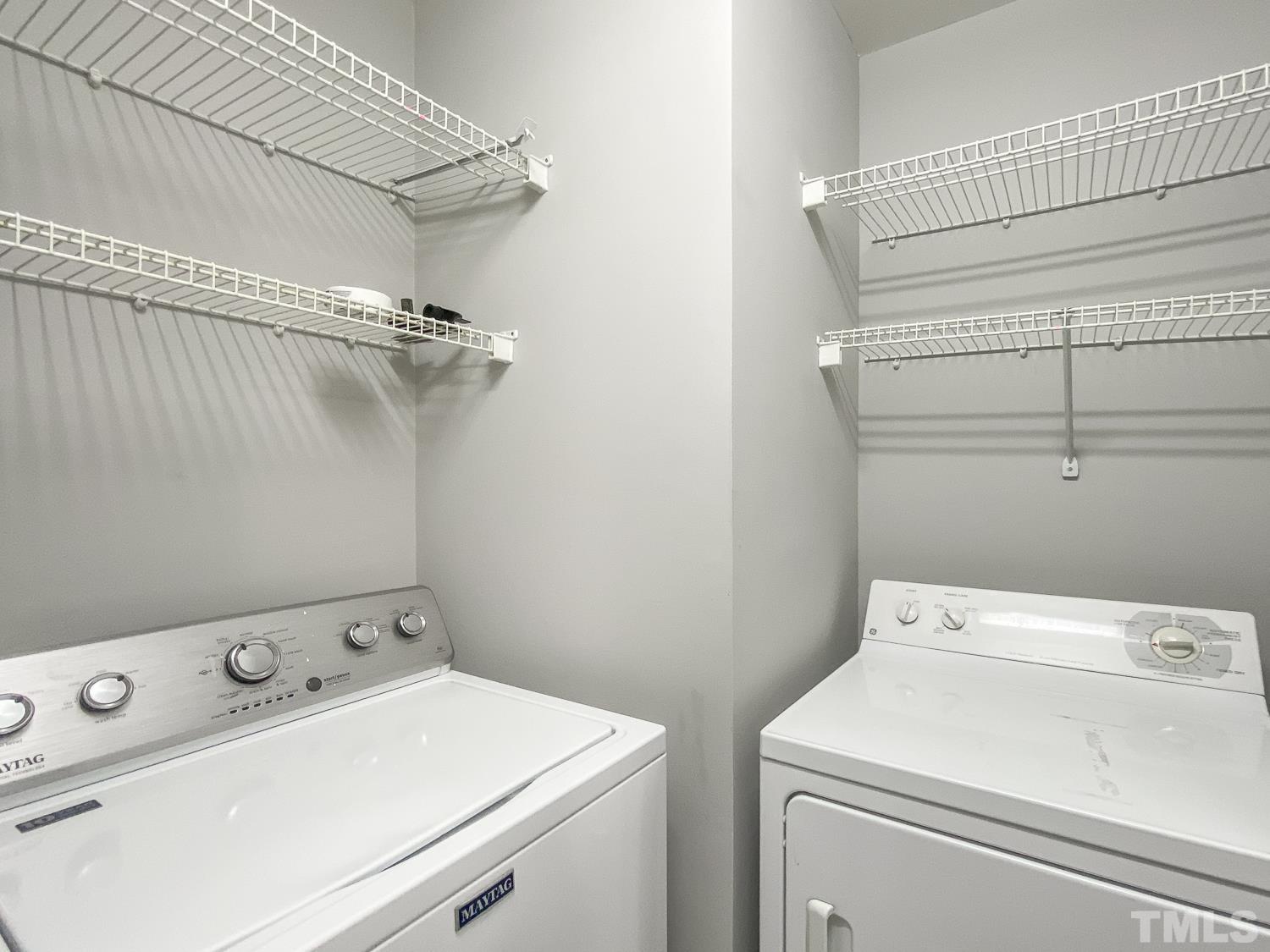 5242 Eagle Trace Drive Raleigh, NC 27604 - Photo 15 of 24 a utility room with dryer and washer