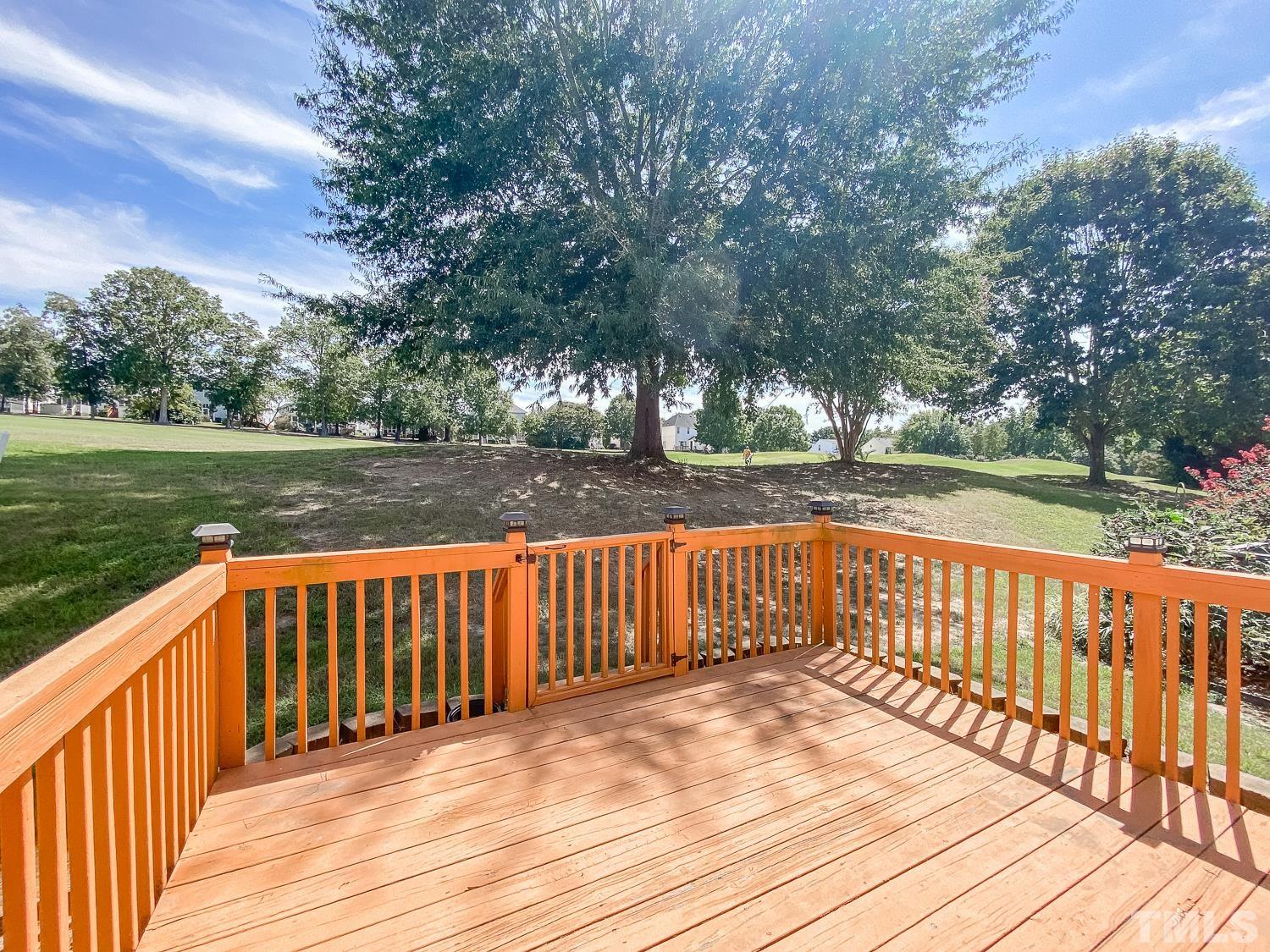 5242 Eagle Trace Drive Raleigh, NC 27604 - Photo 22 of 24 a view of wooden deck and garden