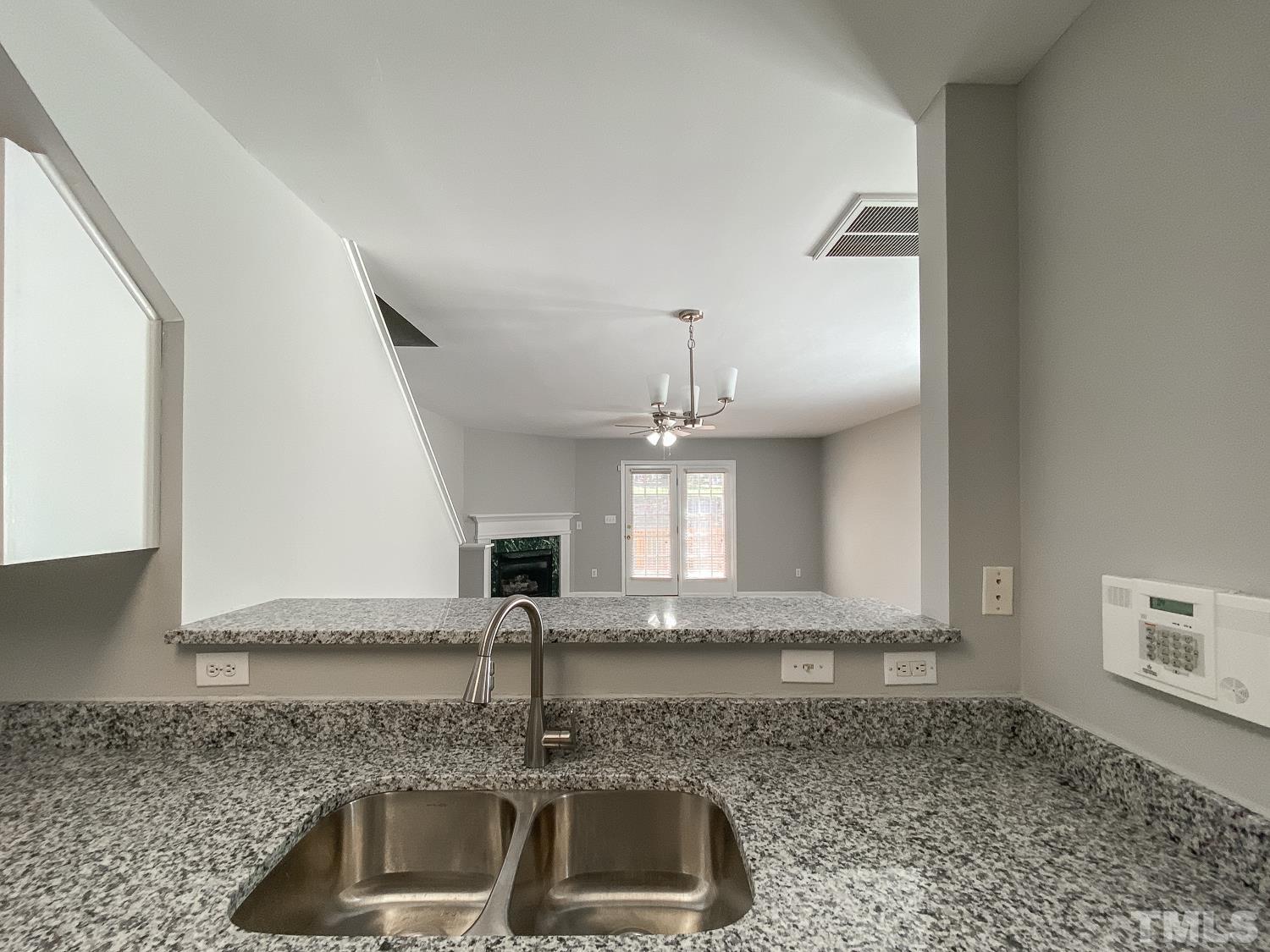 5242 Eagle Trace Drive Raleigh, NC 27604 - Photo 5 of 24 a kitchen with sink a stove and cabinets