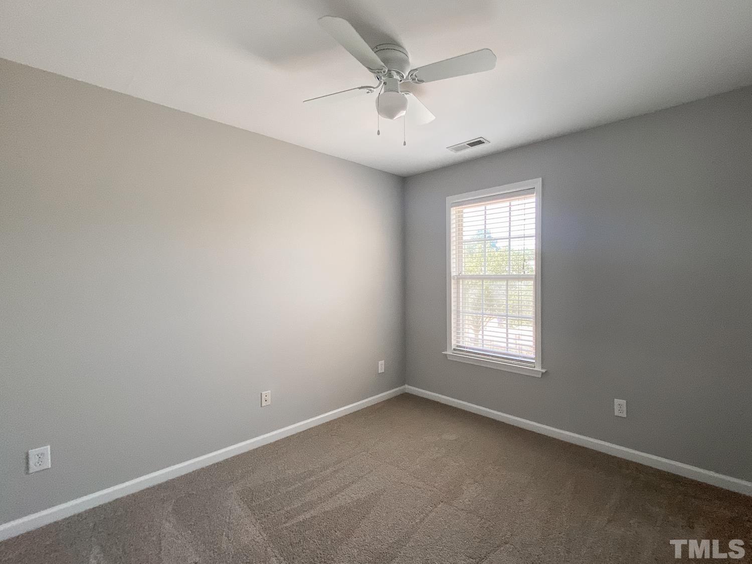 5242 Eagle Trace Drive Raleigh, NC 27604 - Photo 10 of 24 an empty room with a window