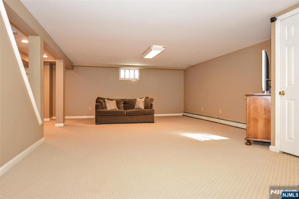 60 Dimmig Road Upper Saddle River, NJ 07458 - Photo 32 of 40 a view of a livingroom with wooden floor and staircase