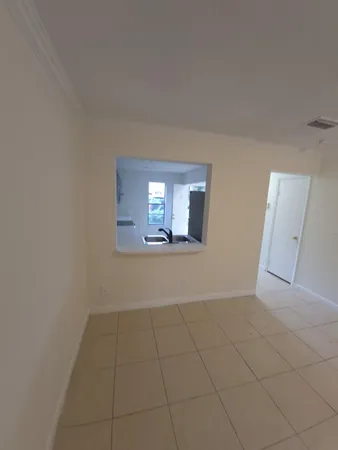 wooden floor in an empty room with a mirror