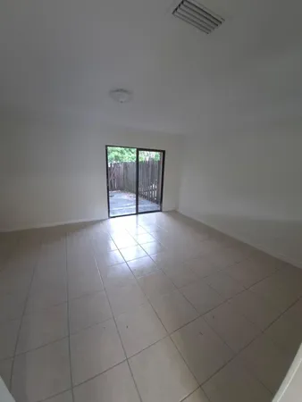 a view of an empty room with windows