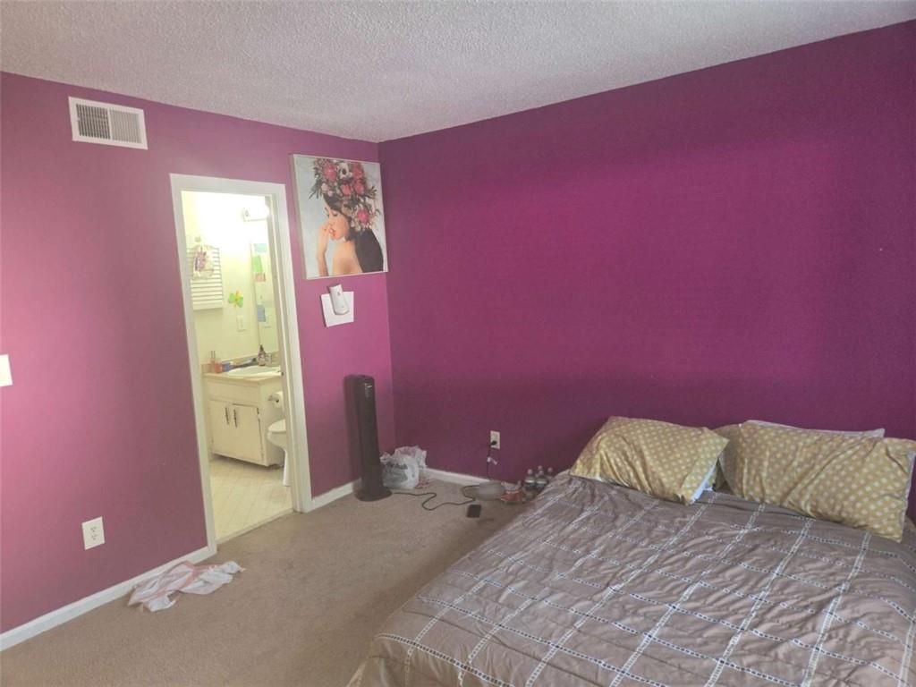 3647 Cobble Mill Lane Clarkston, GA 30021 - Photo 14 of 19 a bedroom with a bed and a window