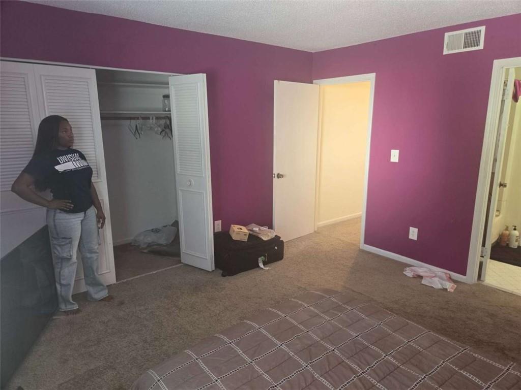 3647 Cobble Mill Lane Clarkston, GA 30021 - Photo 15 of 19 a bed room with a bed and a dresser