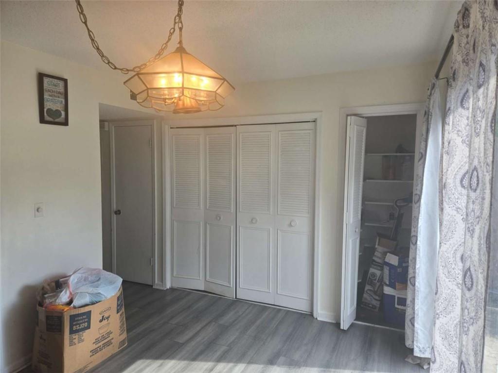 3647 Cobble Mill Lane Clarkston, GA 30021 - Photo 2 of 19 a view of empty room with wooden floor and fan