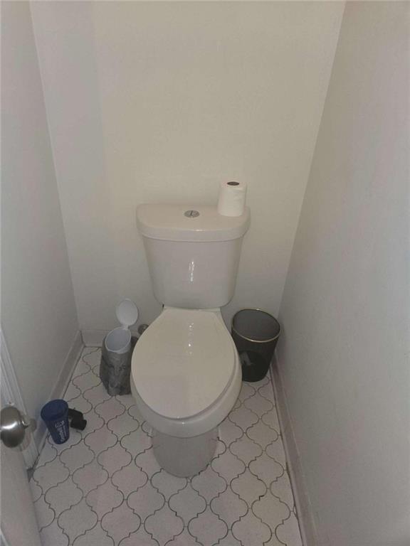 3647 Cobble Mill Lane Clarkston, GA 30021 - Photo 9 of 19 a white toilet sitting next to a white wall