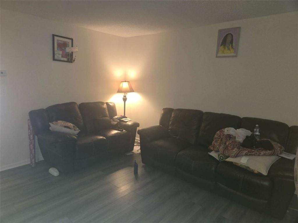 3647 Cobble Mill Lane Clarkston, GA 30021 - Photo 10 of 19 a living room with furniture and a lamp