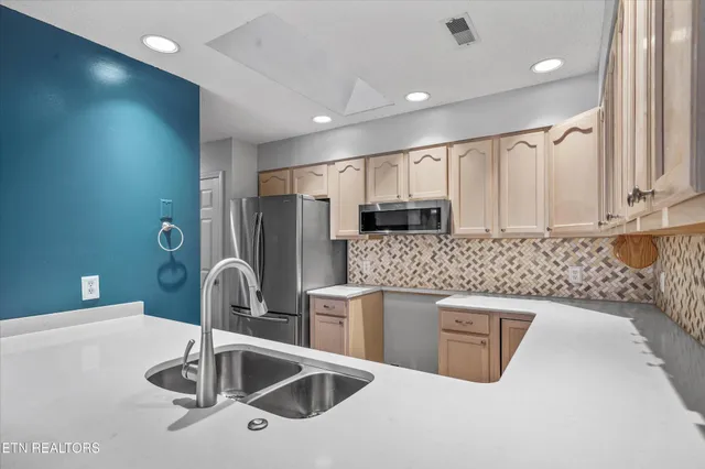 a spacious bedroom with a bed and a couch