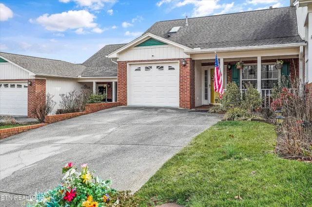 a view of a porch with furniture and backyard