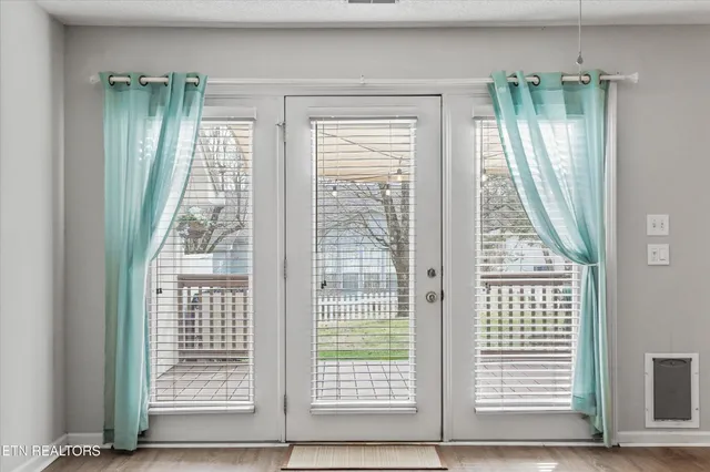 an aerial view of a house with garden space and a car park