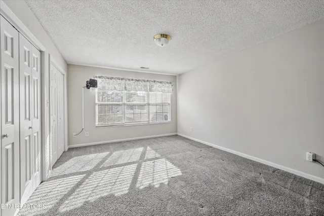 an aerial view of residential building and trees around