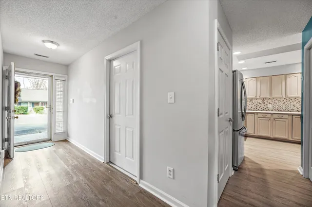a bedroom with a bed a couch and a large window