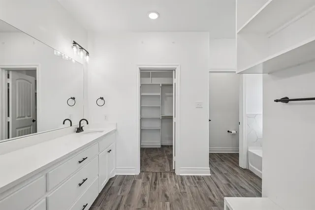 a bathroom with a sink double vanity and a mirror