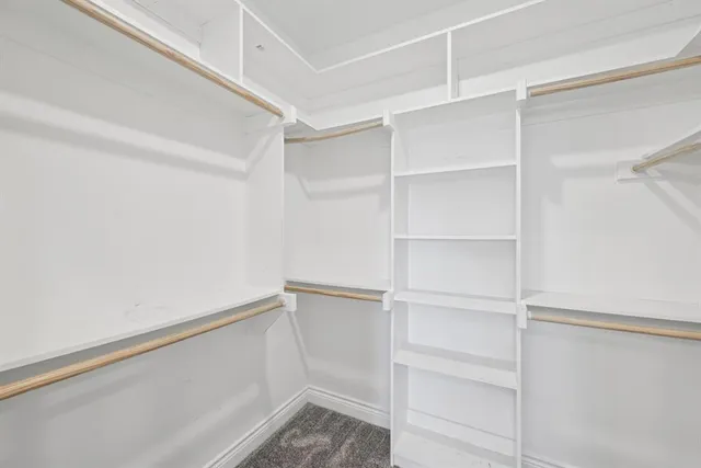 a bathroom with a double vanity sink a mirror and shower