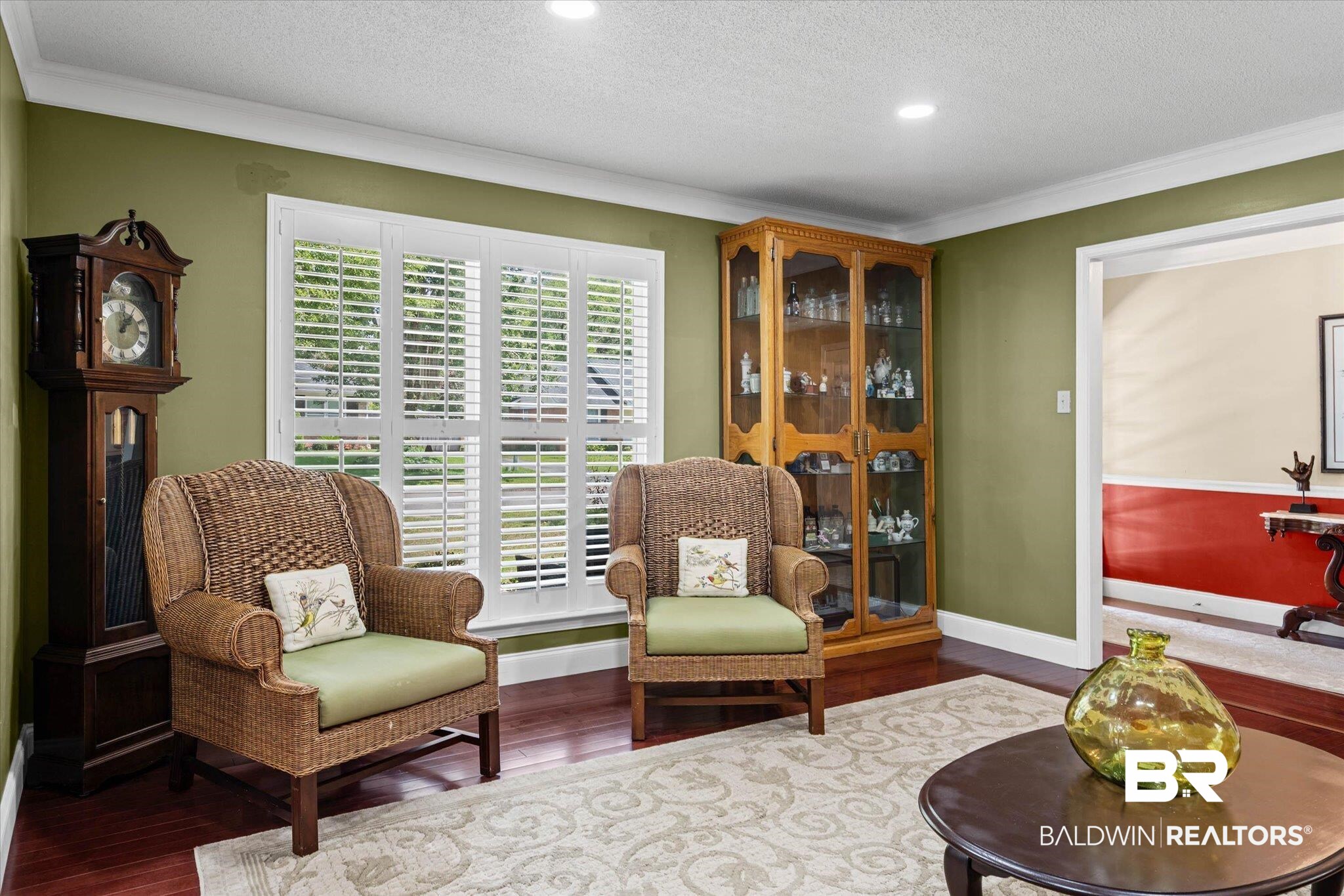 7410 Smithfield Road East Mobile, AL 36695 - Photo 4 of 24 Spacious living area featuring rich wood-finish flooring, a decorative area rug, and recessed lighting