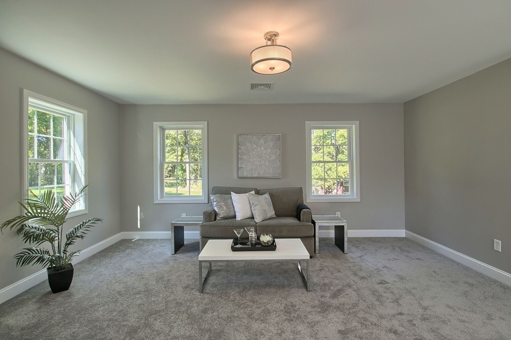 5 Davis Road Chelmsford, MA 01824 - Photo 16 of 27 a living room with furniture and windows