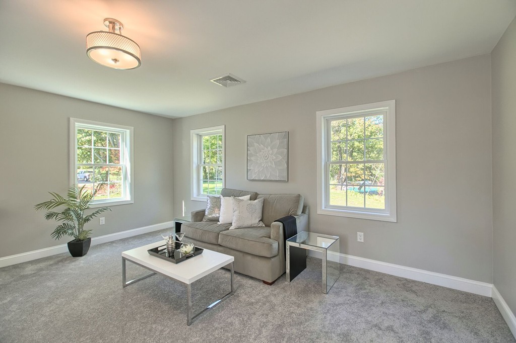 5 Davis Road Chelmsford, MA 01824 - Photo 17 of 27 a living room with furniture potted plant and window