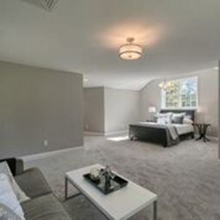 5 Davis Road Chelmsford, MA 01824 - Photo 18 of 27 a living room with furniture and a chandelier