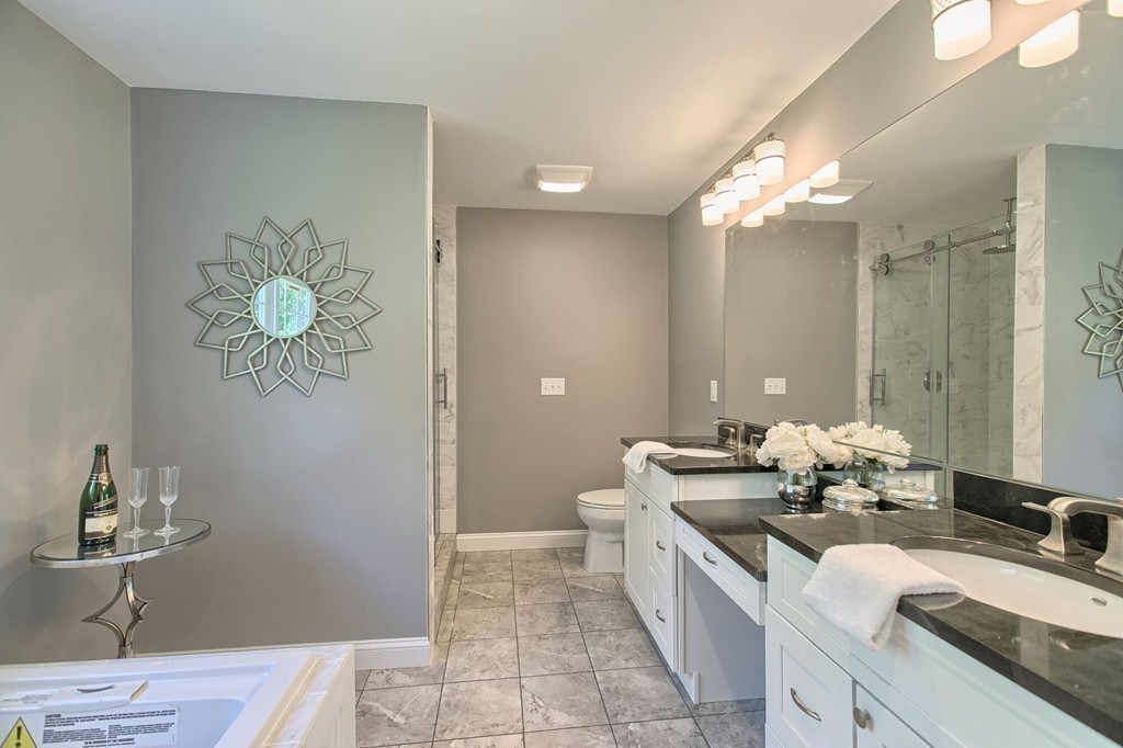 5 Davis Road Chelmsford, MA 01824 - Photo 19 of 27 a bathroom with a double vanity sink and a mirror