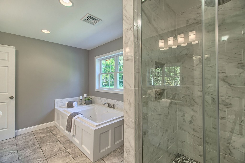 5 Davis Road Chelmsford, MA 01824 - Photo 20 of 27 a bathroom with a sink toilet and shower
