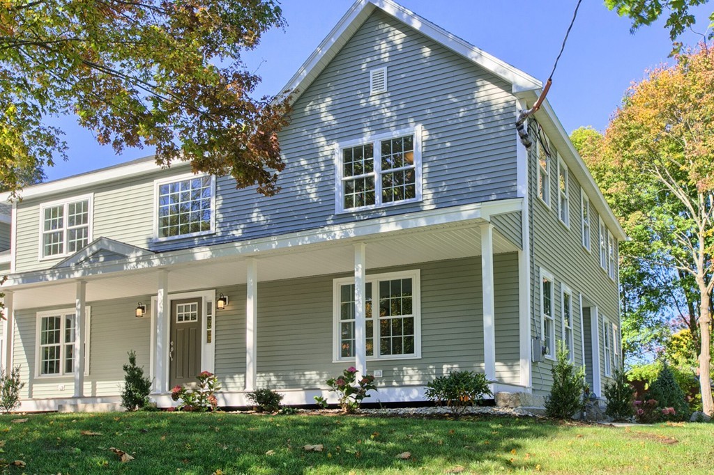 5 Davis Road Chelmsford, MA 01824 - Photo 2 of 27 front view of a house with a yard