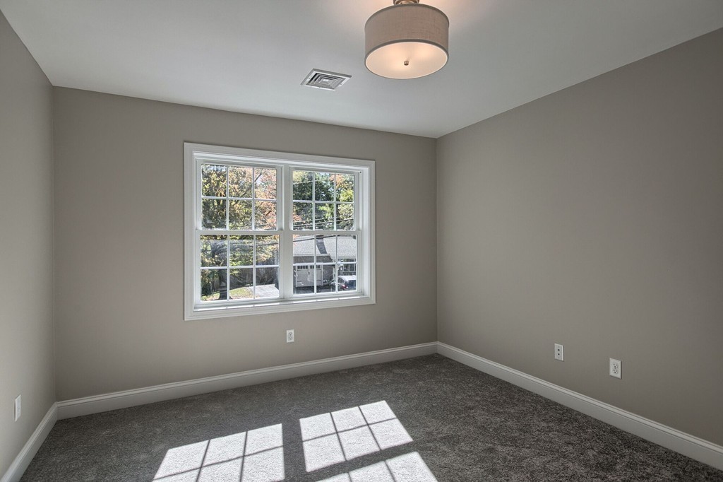 5 Davis Road Chelmsford, MA 01824 - Photo 24 of 27 an empty room with a window