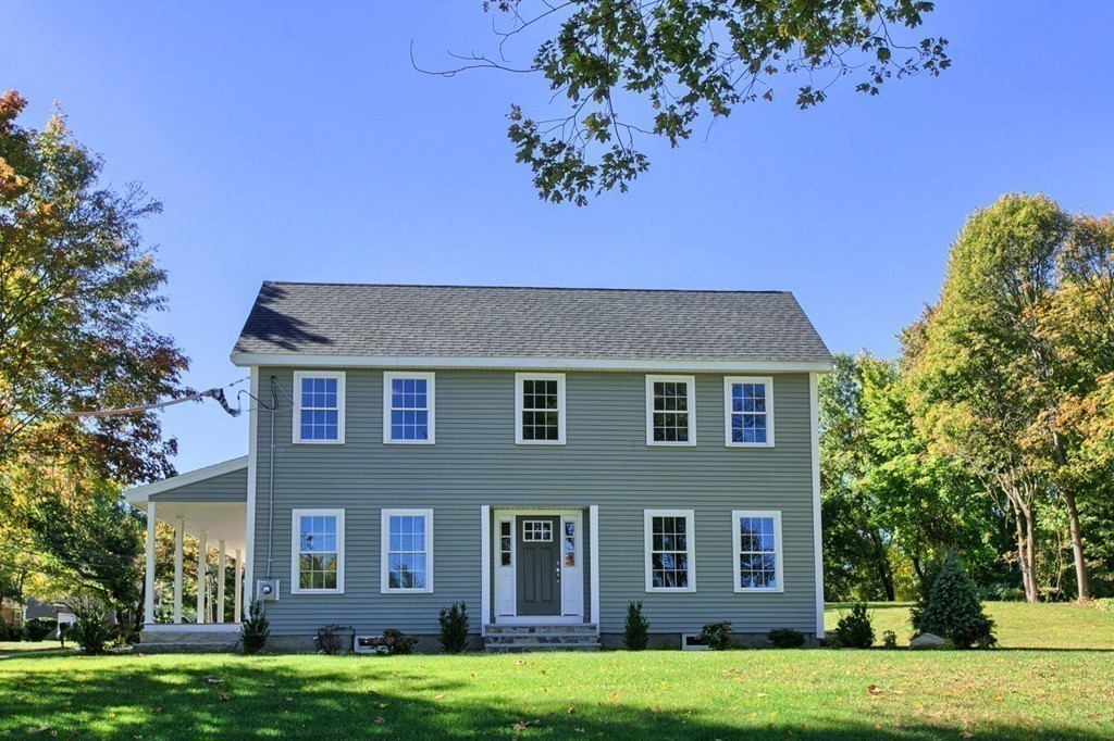 5 Davis Road Chelmsford, MA 01824 - Photo 27 of 27 a front view of a house with a garden