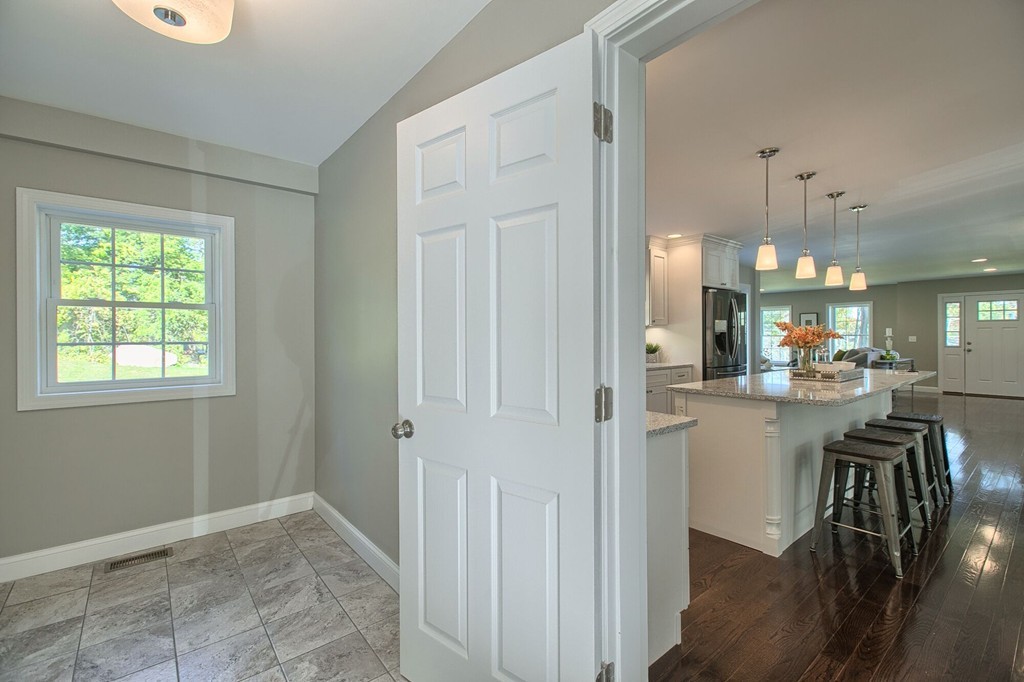 5 Davis Road Chelmsford, MA 01824 - Photo 3 of 27 a view of a kitchen and dining room