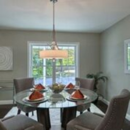 5 Davis Road Chelmsford, MA 01824 - Photo 7 of 27 a dining room with furniture a chandelier and window