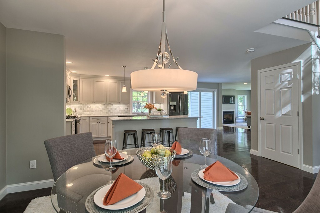 5 Davis Road Chelmsford, MA 01824 - Photo 8 of 27 a dining room with furniture a window and a fireplace