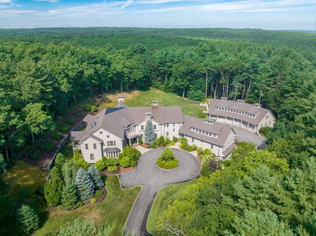 an aerial view of house with yard swimming pool and outdoor seating