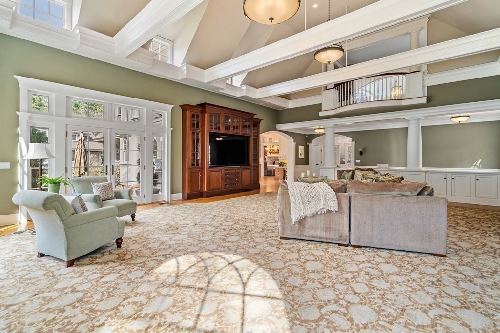145 Dutton Road Sudbury, MA 01776 - Photo 11 of 41 a living room with couches and kitchen view