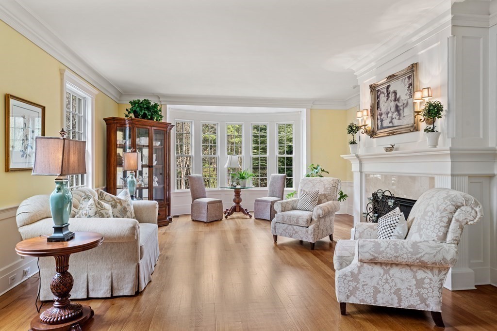 145 Dutton Road Sudbury, MA 01776 - Photo 13 of 41 a living room with furniture and a fireplace