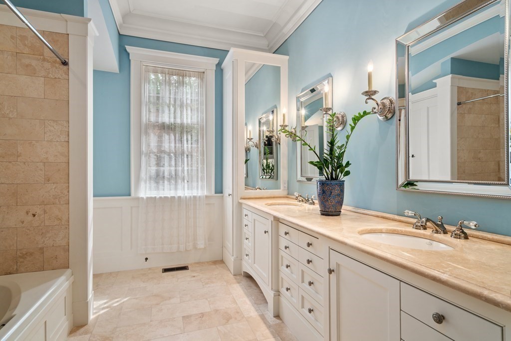 145 Dutton Road Sudbury, MA 01776 - Photo 16 of 41 a bathroom with a granite countertop sink a mirror and a bathtub