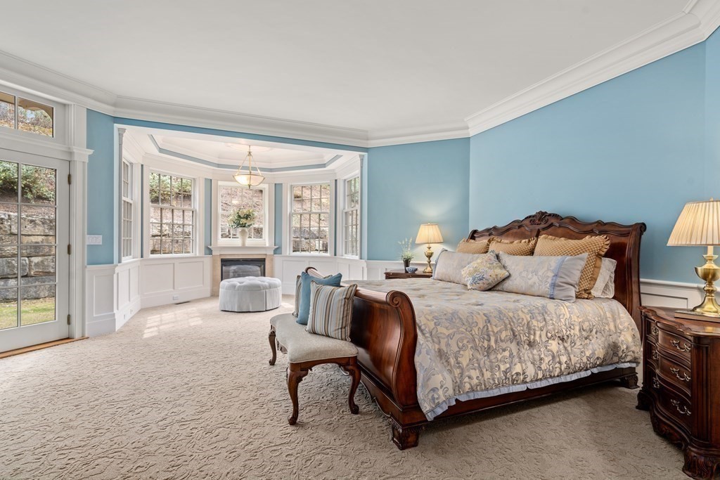 145 Dutton Road Sudbury, MA 01776 - Photo 17 of 41 a bedroom with a bed a table and chair