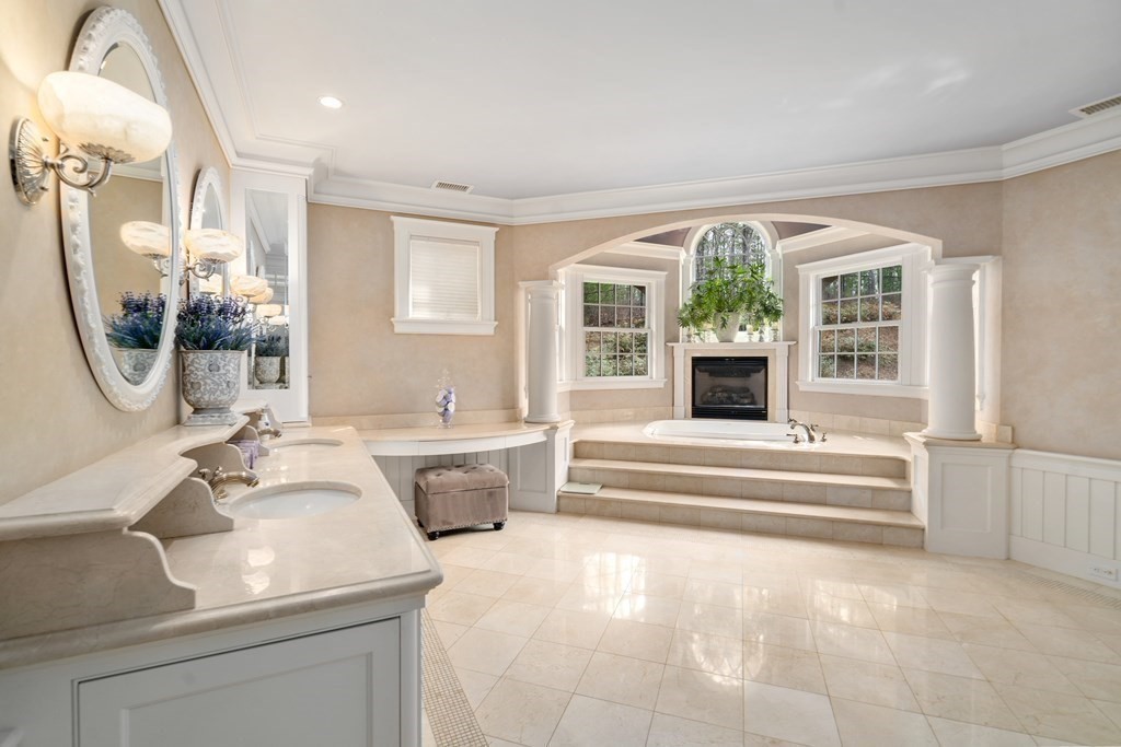 145 Dutton Road Sudbury, MA 01776 - Photo 23 of 41 a spacious bathroom with a tub sink and mirror