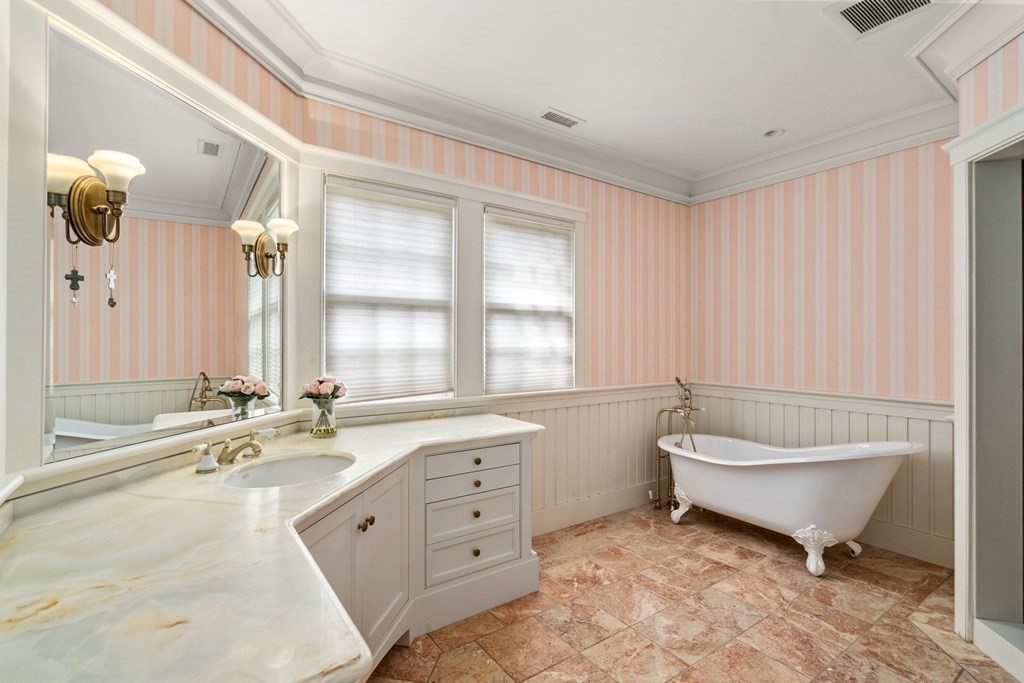 145 Dutton Road Sudbury, MA 01776 - Photo 25 of 41 a bathroom with a granite countertop toilet a sink and bathtub