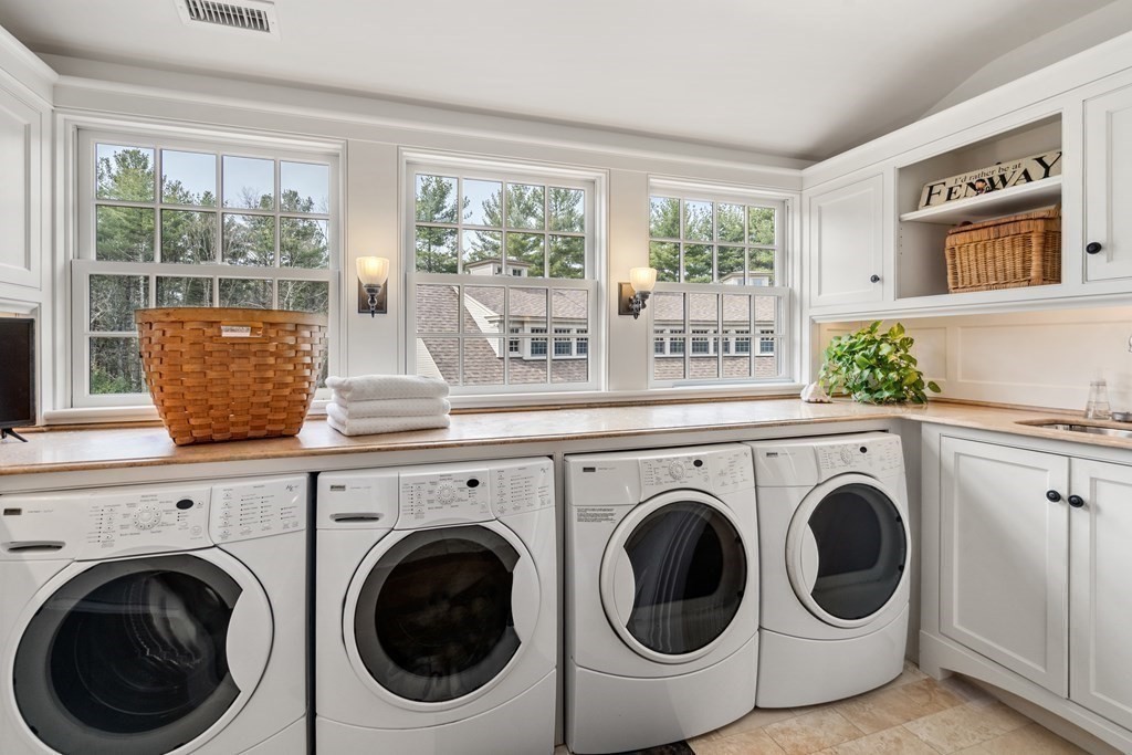 145 Dutton Road Sudbury, MA 01776 - Photo 29 of 41 a view of entryway with washer and dryer