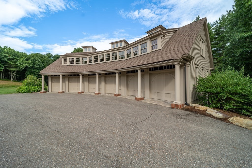 145 Dutton Road Sudbury, MA 01776 - Photo 32 of 41 a front view of a house with a garden