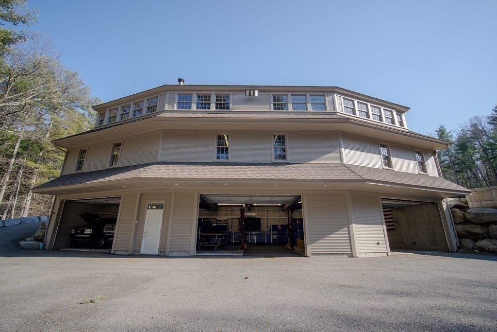 145 Dutton Road Sudbury, MA 01776 - Photo 35 of 41 a view of a building with a balcony
