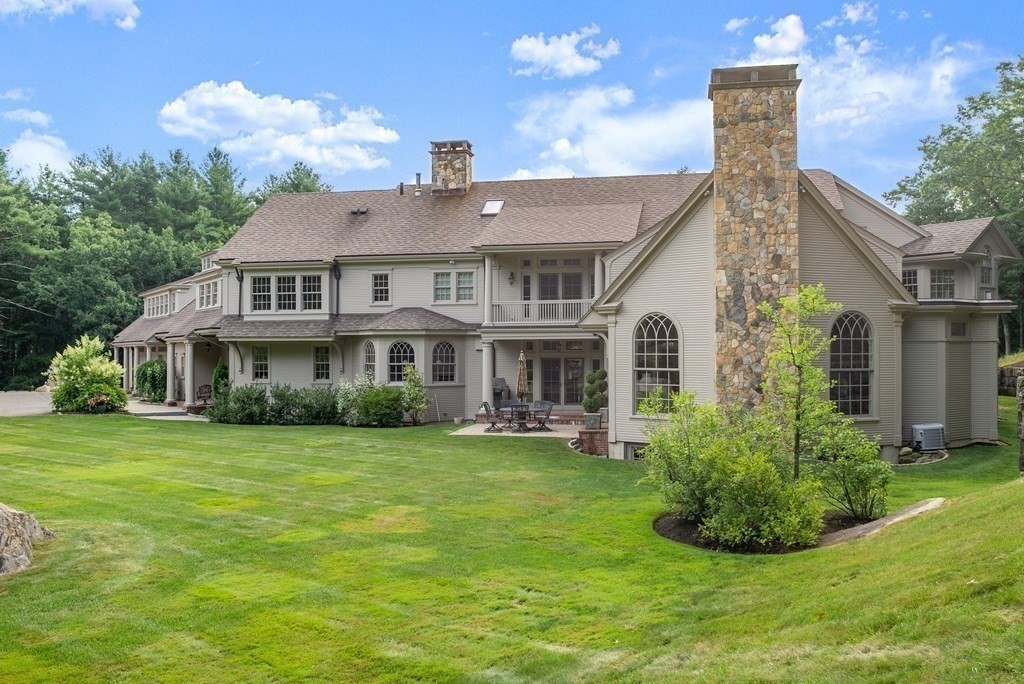 145 Dutton Road Sudbury, MA 01776 - Photo 40 of 41 a front view of a house with a garden