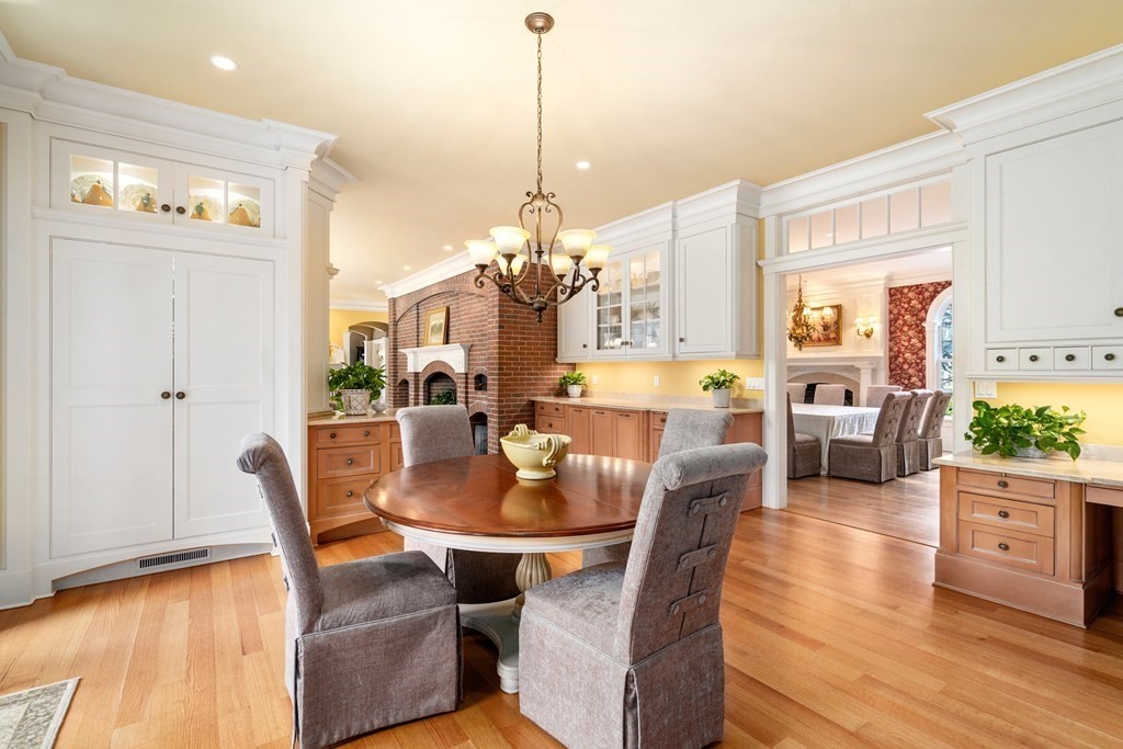 145 Dutton Road Sudbury, MA 01776 - Photo 8 of 41 a dining room with furniture a chandelier and wooden floor